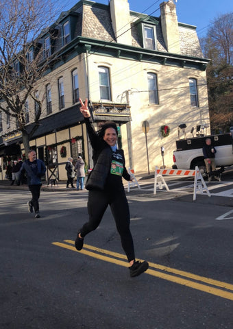 A happy woman running