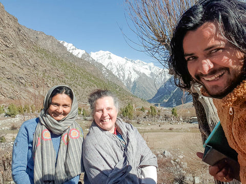 three people sit in the Miyar Valley Himachal Pradesh