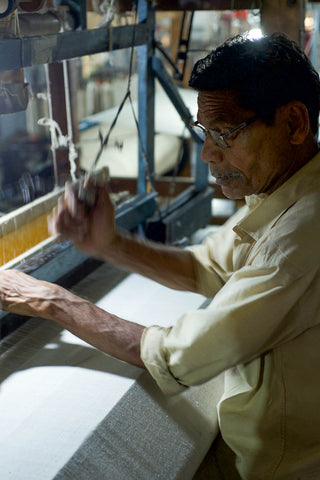 a weaver weaves on a handloom in wardha maharashtra