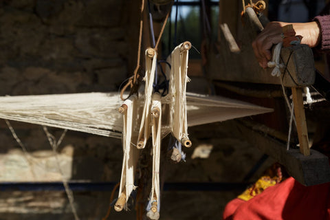 sun shines on yarn on traditional weaving loom in Himachal Pradesh India