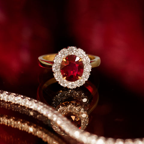 Ruby and Diamond Halo Ring in yellow gold and platinum