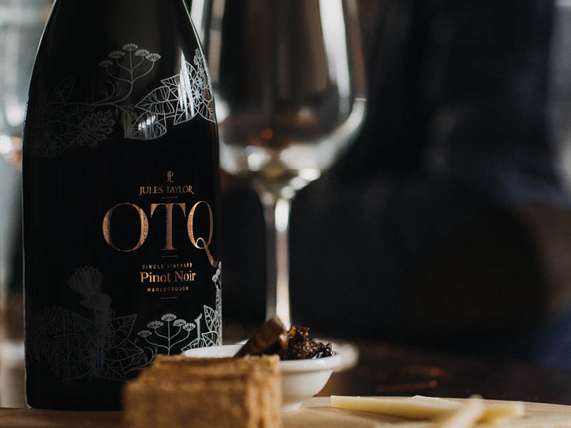 A bottle of OTQ Organic Pinot Noir 2021