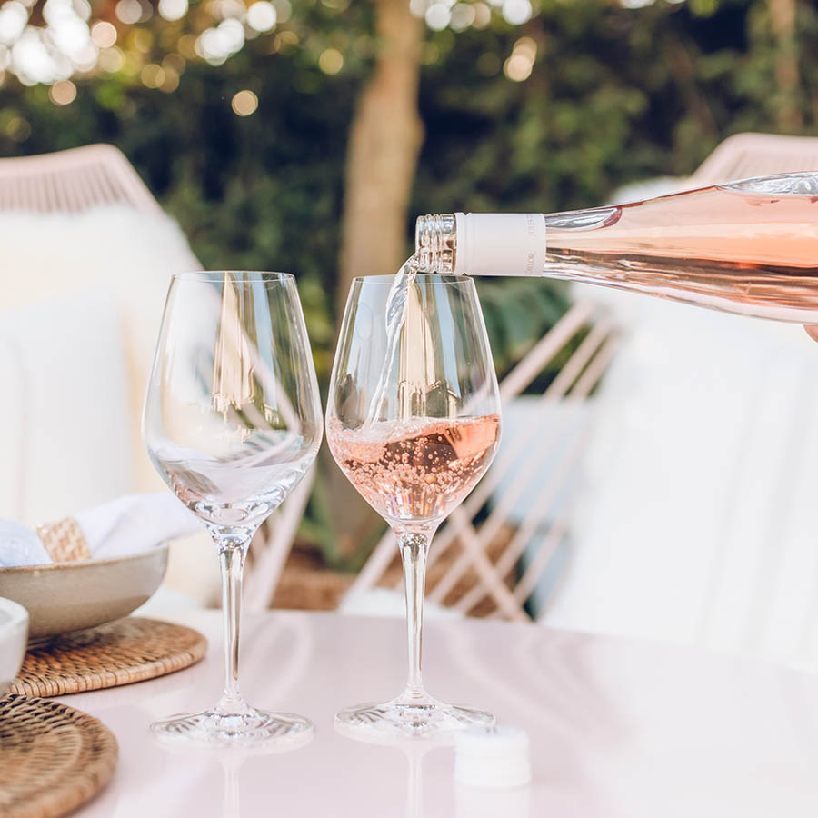 Close up of the Jules Rose pouring into Wine Glasses