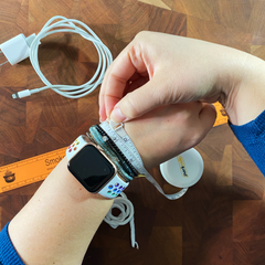 a tape measure is wrapped around a woman's wrist