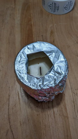 how to fix tunneling candle with tin foil. wrap top and poke a hole in the center of the foil. 