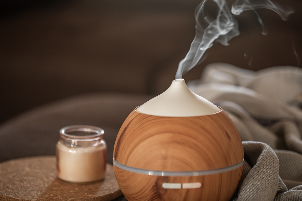aromatherapy essential oil diffuser and a candle