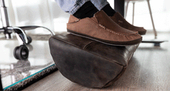 a moving image of a leather foot rest rocker moving back and forth