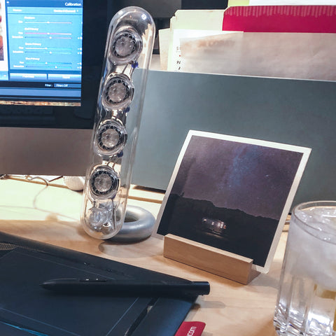Glass speakers on a computer desktop