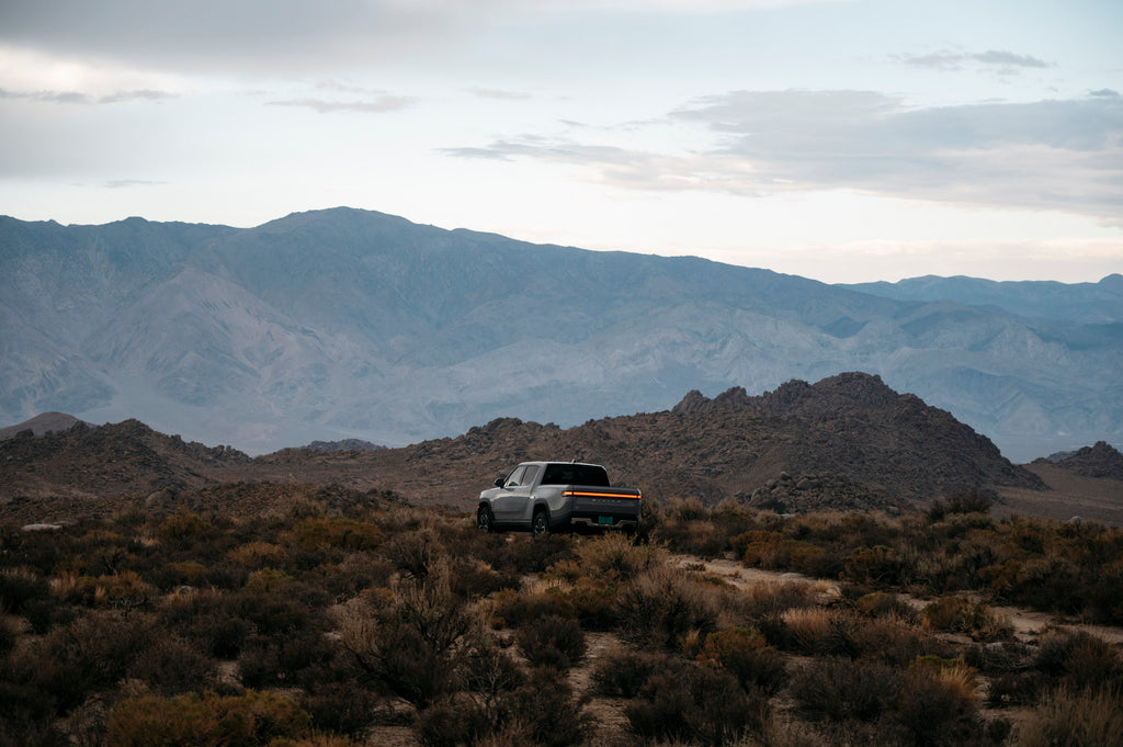 Rear view of Limestone Rivian R1T at dusk in Lone Pine, CA