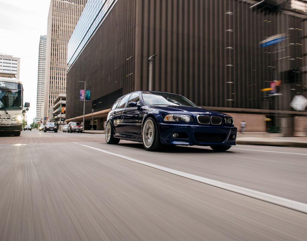 Rolling front three quarter view of Interlagos Blue BMW M3 Touring (E46)