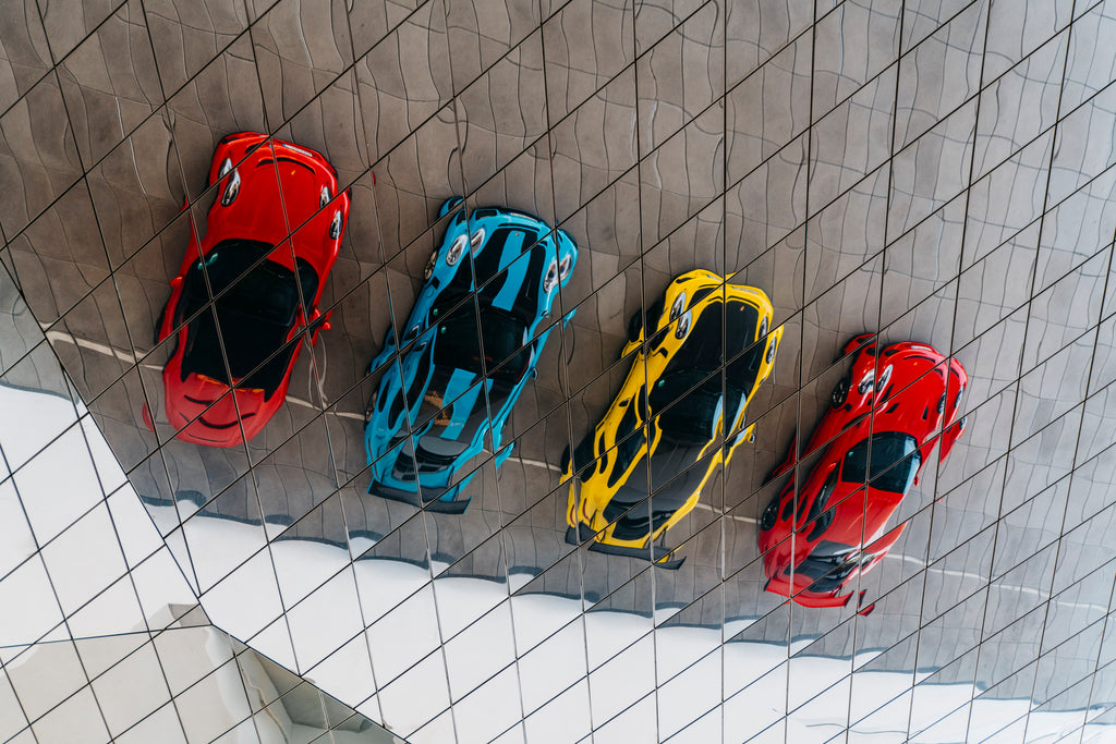 Reflected view of Guards Red Porsche 911 GT3 RS and GT2 RS