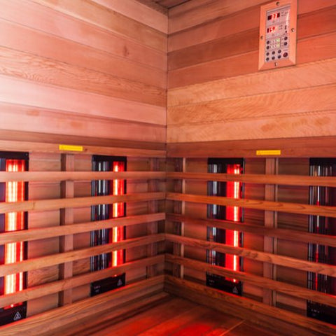 Inside view of infrared sauna with small yellow danger stickers