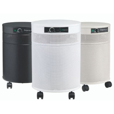 Set of Airpura R600 all-purpose everyday air purifiers in black, white, and cream, engineered to effectively remove laser cutter debree.