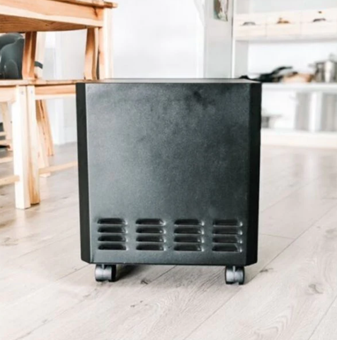 Black EnviroKlenz Mobile Air System on wheels, positioned on a wooden floor with a modern interior background