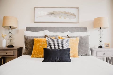Yellow and black throw pillow combination idea in bedroom