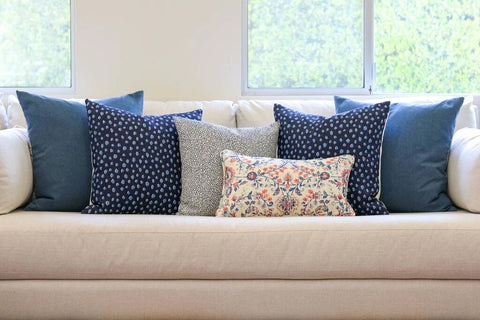 Navy Blue Printed Pillows on a White Couch