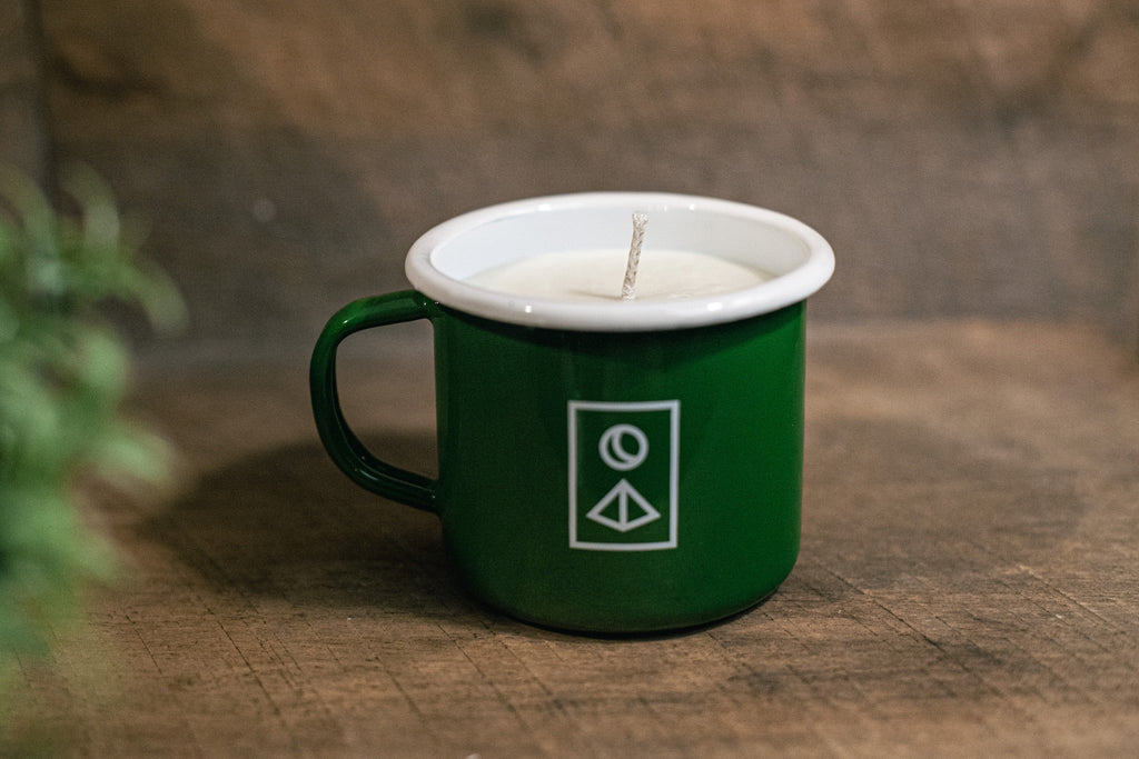 a custom candle poured in a mug