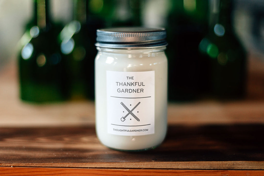 candle with the label "The Thankful Gardner"