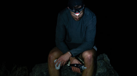 runner takes a break in a chair at night