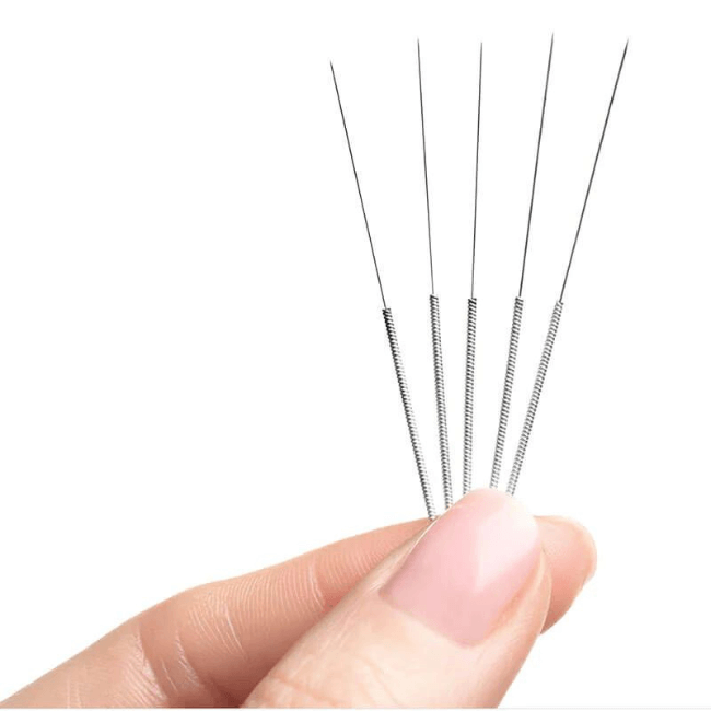 Thin Acupuncture needles are inserted into specific points along the body