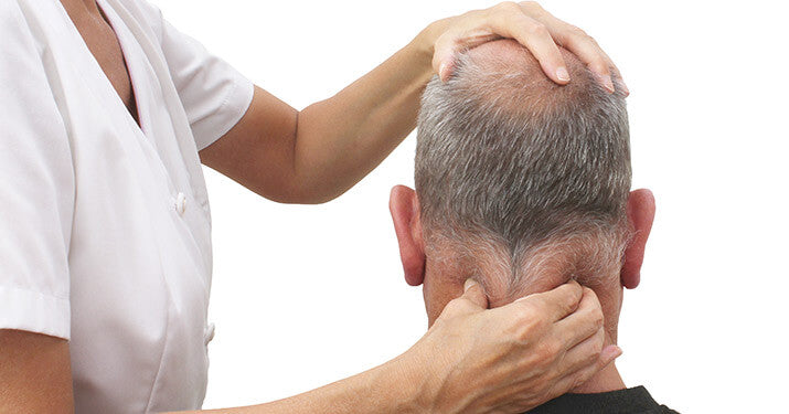 RMT giving man a neck massage headache pain relief