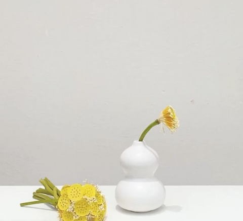 Cute tabletop vase with yellow flowers