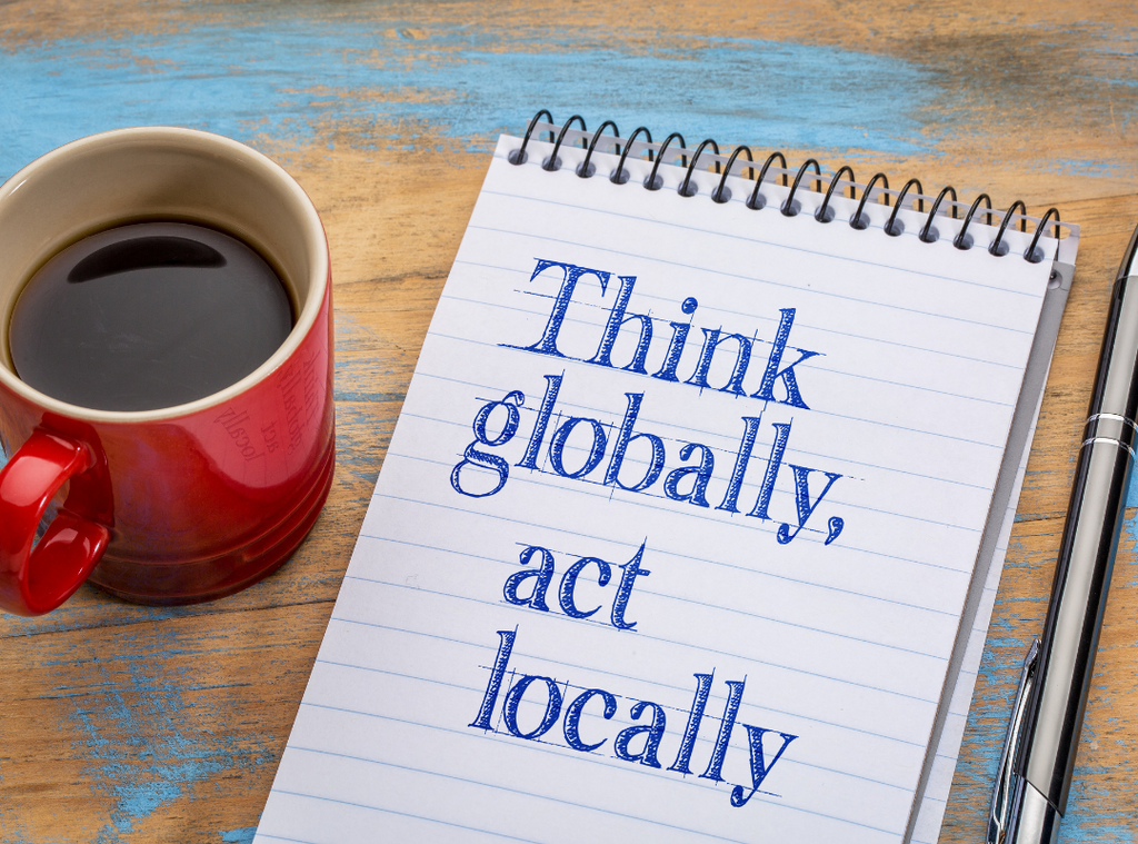 Notepad with inscription 'think globally, act locally'