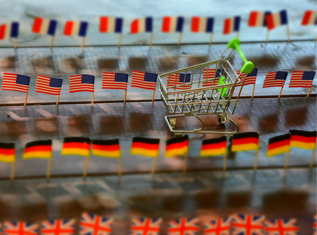 Shopping trolley with lines of country flags representing UK, USA, Germany and France