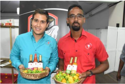 Scotch Boyz principals Drew Gray (left) and Matthew Wallace show off their nominated products (from left) jerk sauce, authentic Jamaican hot pepper sauce, Jamaican fish and meat sauce, habanero pepper sauce and Scotch bonnet pepper sauce.