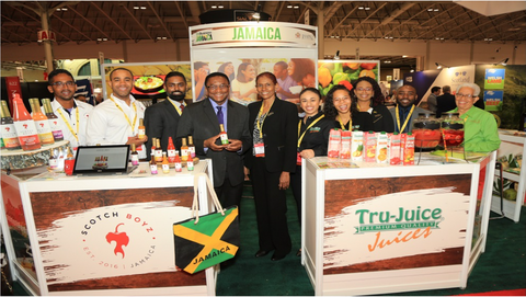 Toronto Deputy Mayor, Chair, Economic and Community Development Committee, and Councillor, Scarborough Centre, Michael Thompson (centre left) takes a photo with the Jamaican delegation including representatives from Scotch Boyz, JAMPRO, Tru Juice, Caribbean Dreams and Linga Ya, at trade exhibition SIAL Canada.