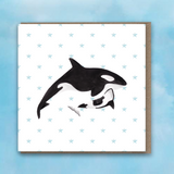 Greeting card with pink heart background, Orca and Baby Orca in centre