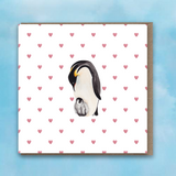Greeting card with pink heart background, Penguin and Baby Penguin in centre