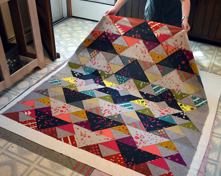 Spray baste quilt top