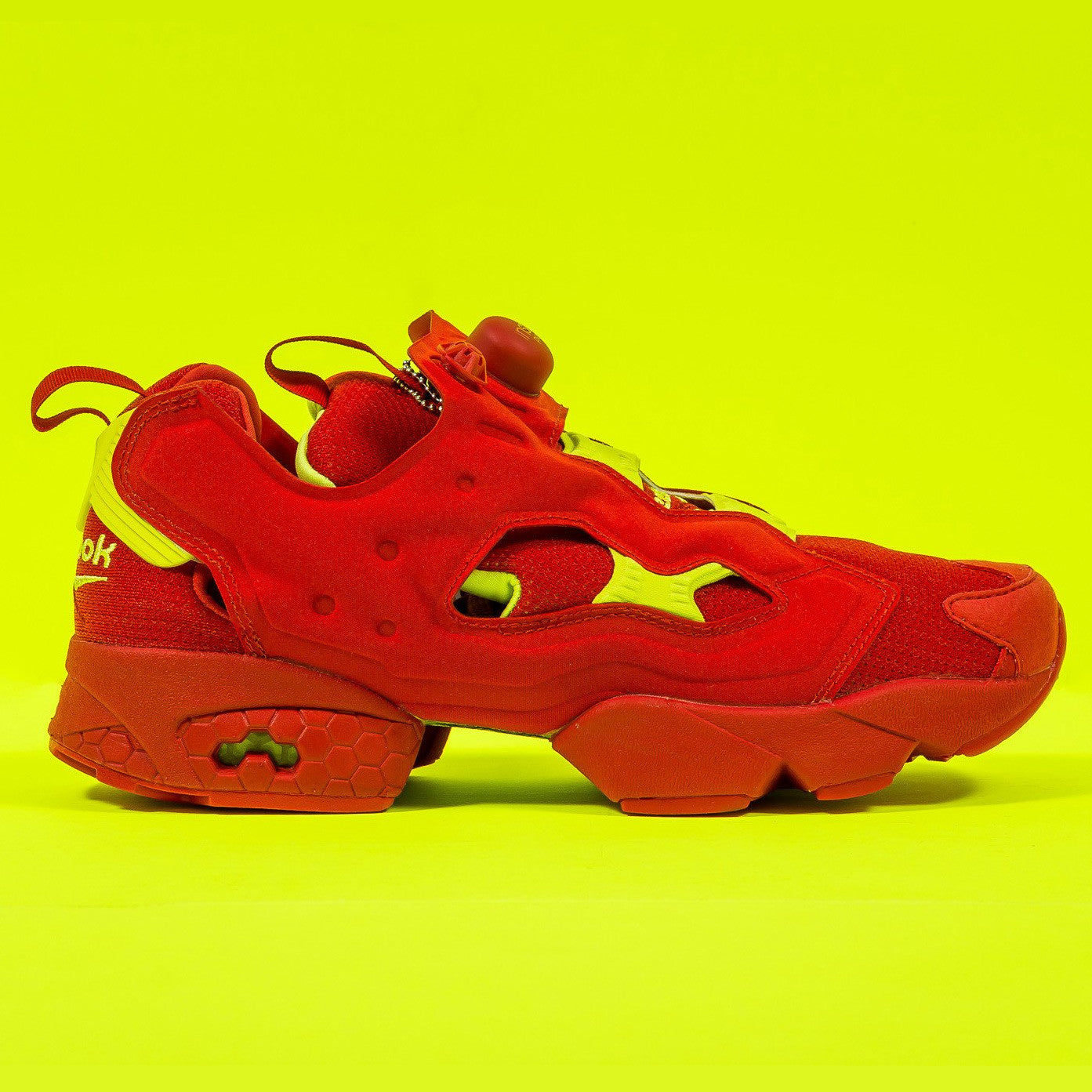 red and yellow reebok pumps