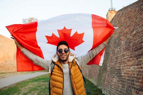 Man holding a Canadian flag