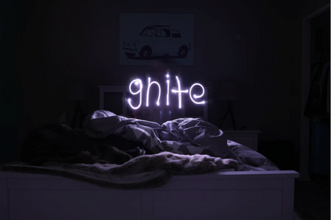 dark room with gnite text 