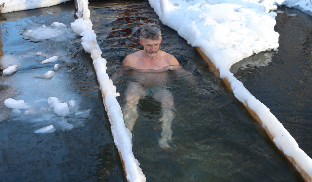 man in ice pool