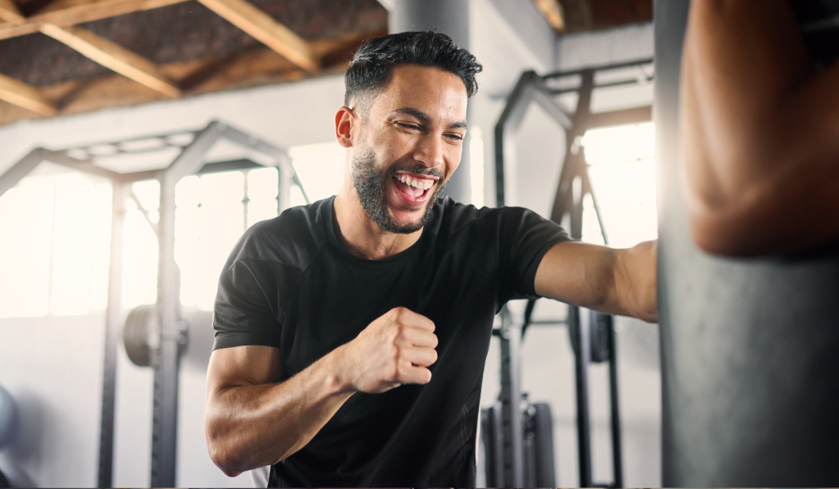 man smiling while working out