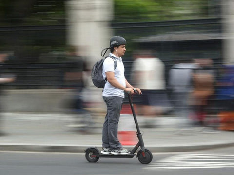 man on E scooter