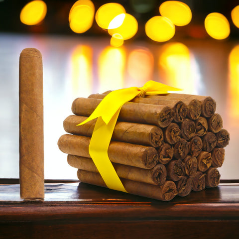Fox House Blend Robusta cigars: A bundle wrapped with a yellow ribbon sits on a wooden table, with a single cigar standing upright beside it.