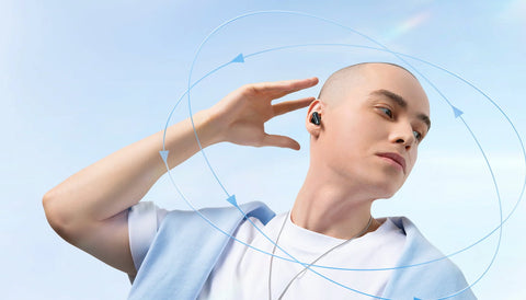 man wearing spatial audio earbuds