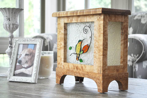 Hummingbird Lightbox on coffee table next to a small white photo frame