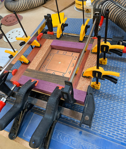 Red Log Cabin Clock Under Production