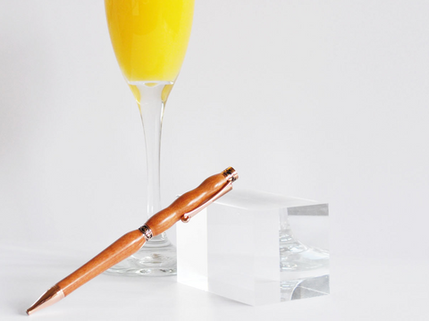 Pink Ivory pen and orange juice