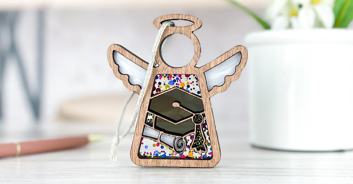 A Mother’s Angels® ornament with a graduation cap design, displayed as a perfect graduation gift and a thoughtful graduation present for her.