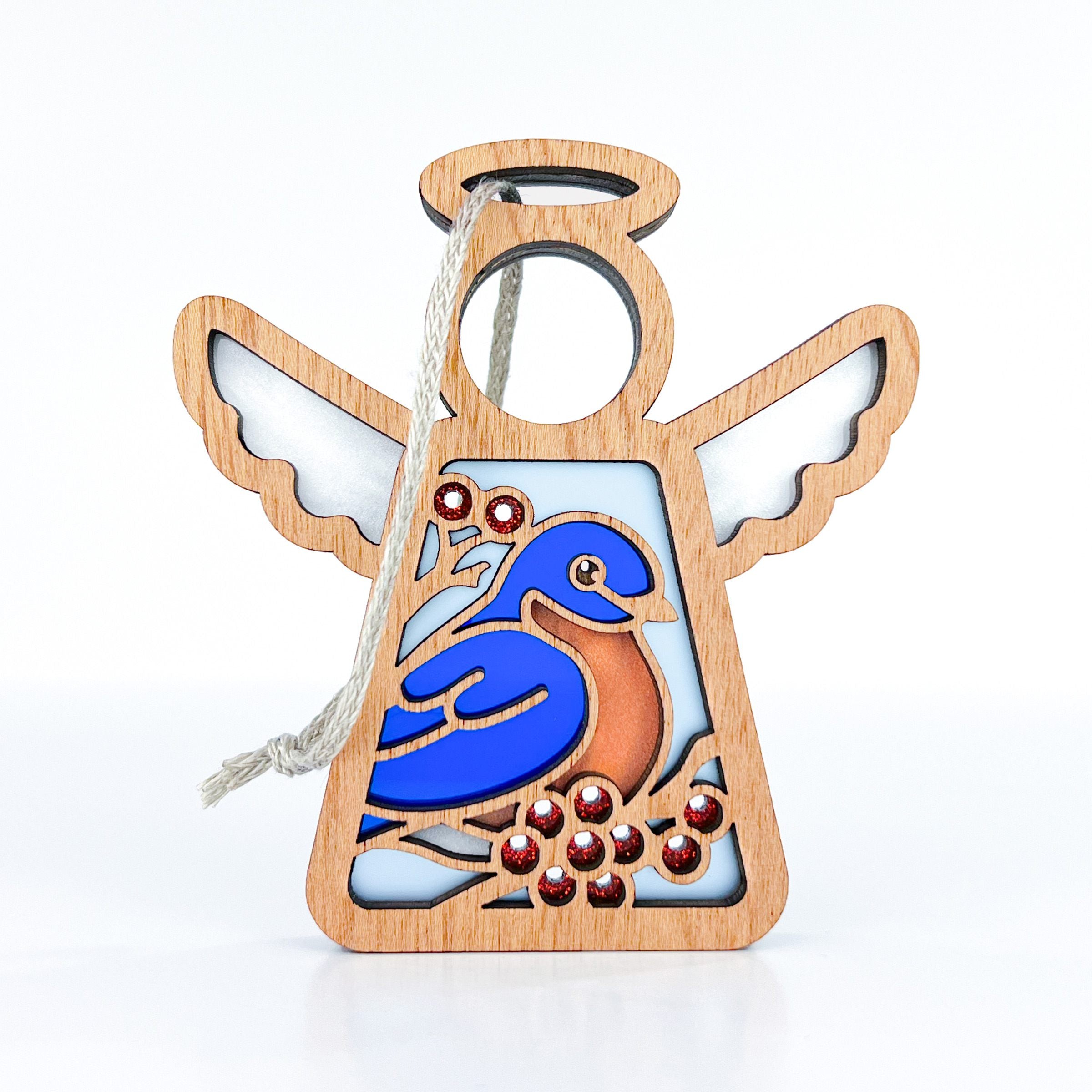 Handcrafted bluebird ornament with bright blue and orange details, perfect as a bluebird gift and bird house decor, symbolizing spiritual meaning and gifts of hope.