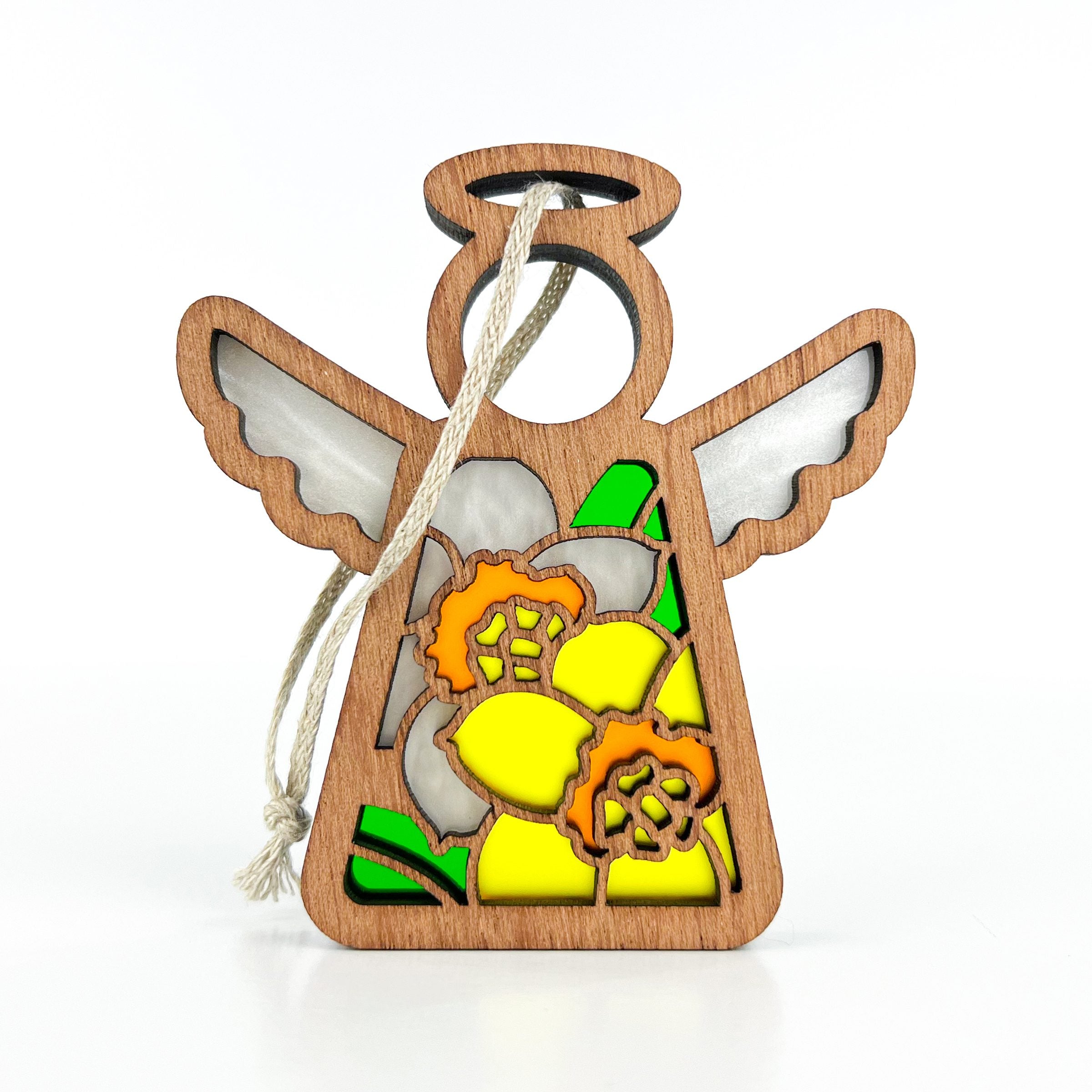Mother’s Angels® Daffodils Ornament featuring vibrant yellow and green stained glass-inspired motifs, symbolizing the birth flower for the month of March. This handcrafted ornament from Forged Flare® shines with the essence of spring, making it an ideal daffodil gift to capture the season's spirit.