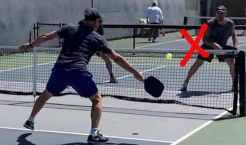 People playing pickleball with x in the image marking a spot of discussion in this post