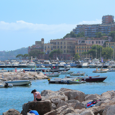 Buildings on side and rocks