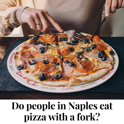 Lady cutting pizza on a plate with fork and knife